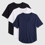 Three short-sleeve V-neck t-shirts stacked in a fan arrangement on a light gray background, shown in black, white, and navy blue.