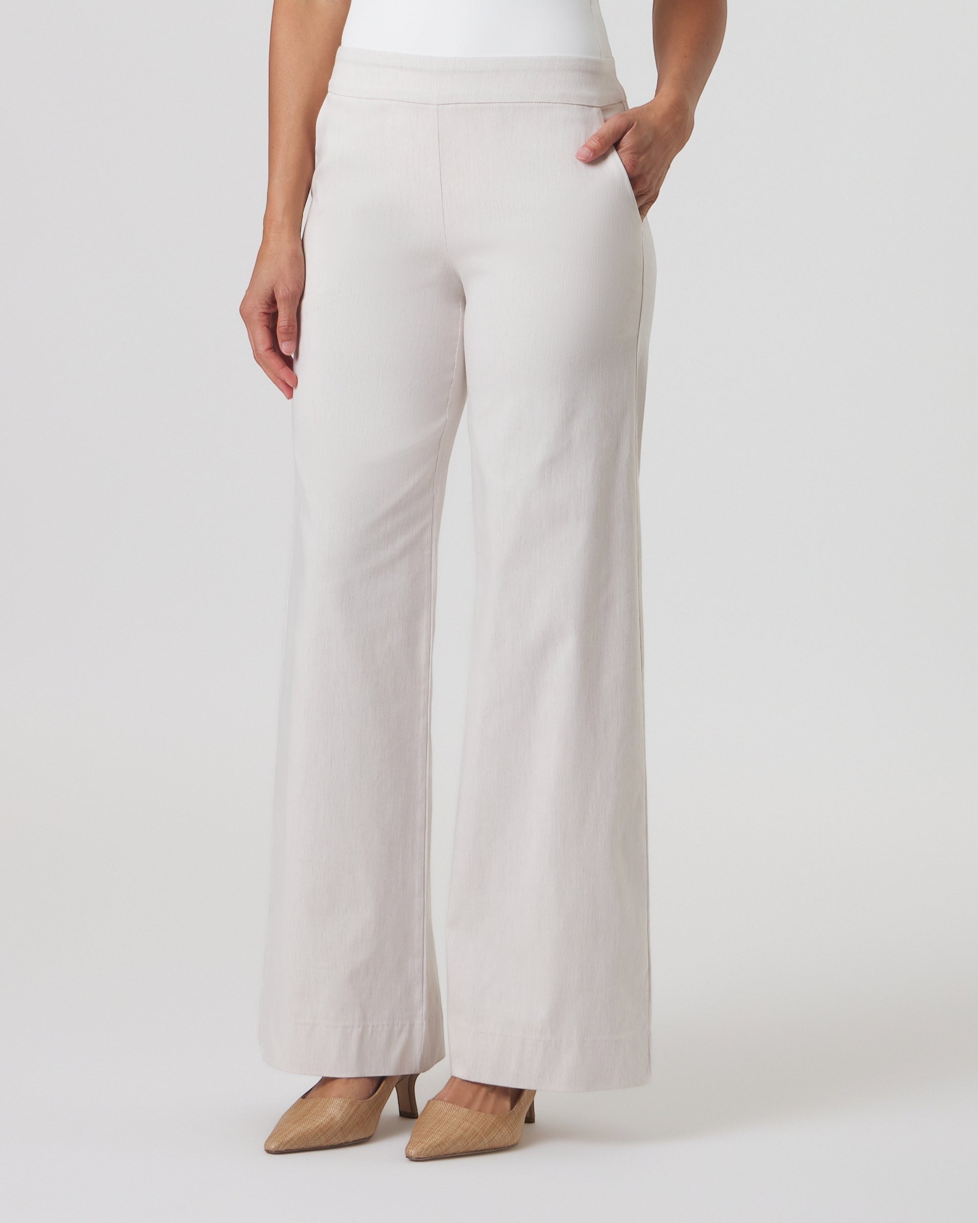 Franne Golde Mayfair wide leg pinstripe pants in cream with a contoured waistband and front slant pockets.